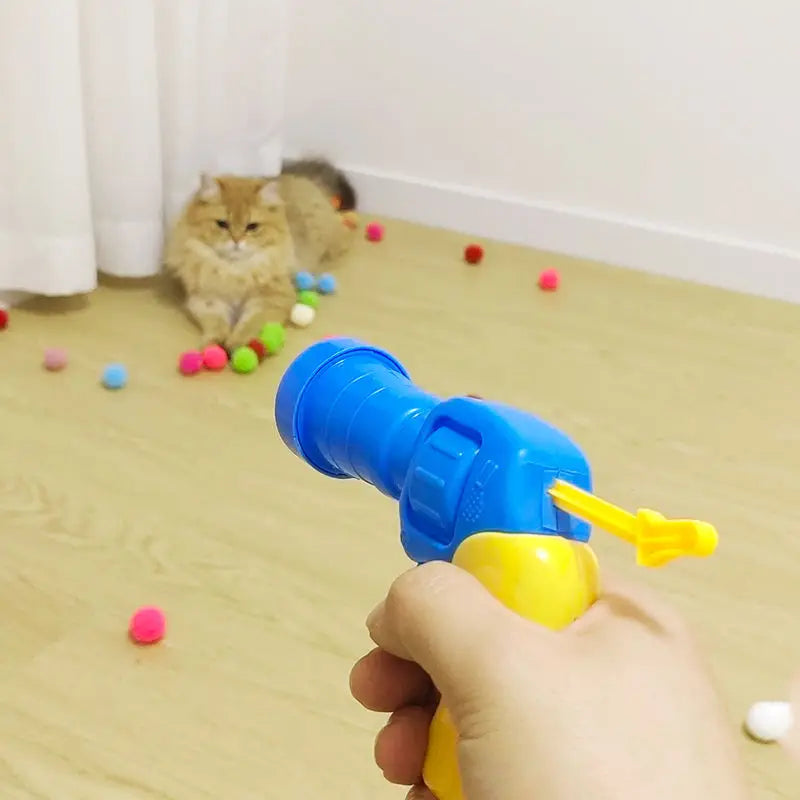 ポンポン銃のおもちゃ猫